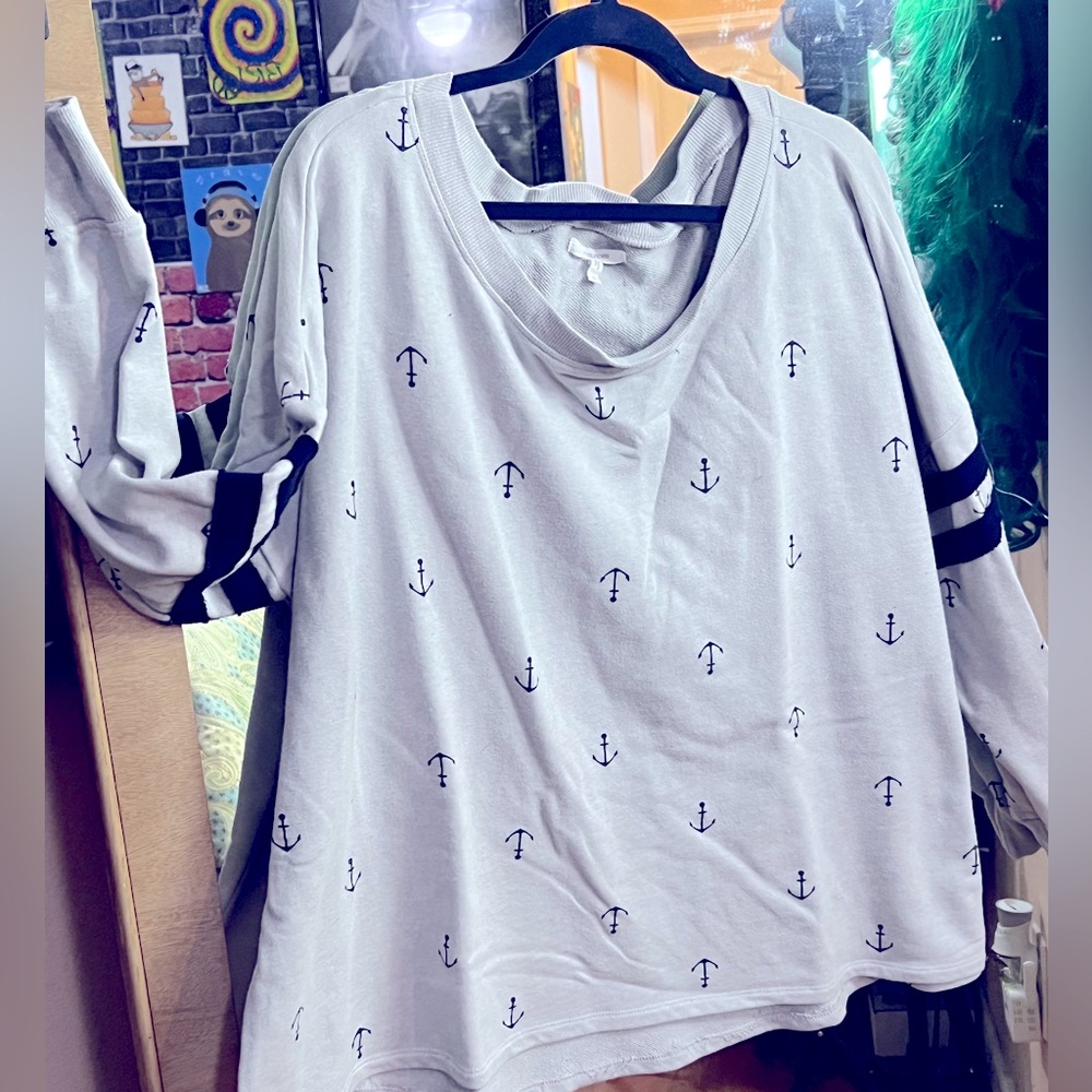 Wide boat neck, long sleeved sweatshirt